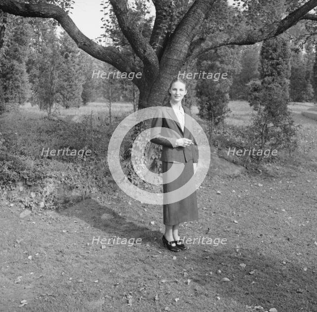 Ruth, standing outdoors by a tree, 1936 Creator: Arnold Genthe.