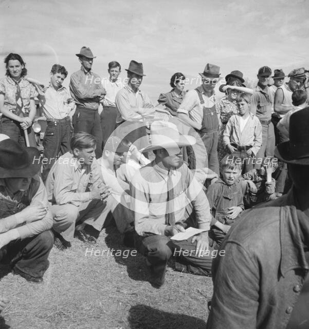 Watching ball game, Shafter migrant camp, California, 1938. Creator: Dorothea Lange.