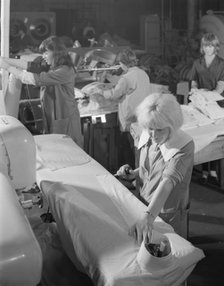 Shirt pressing at a commercial laundry in Scunthorpe, Lincolnshire, 1965.  Artist: Michael Walters