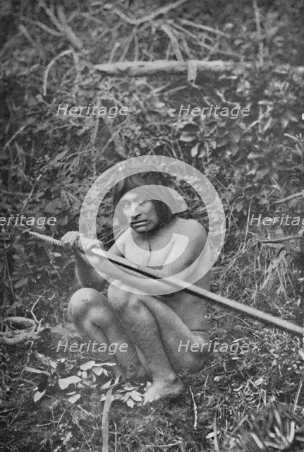 'A Yaghan Attaching The Head of His Harpoon to the Shaft', 1911. Artist: Unknown.