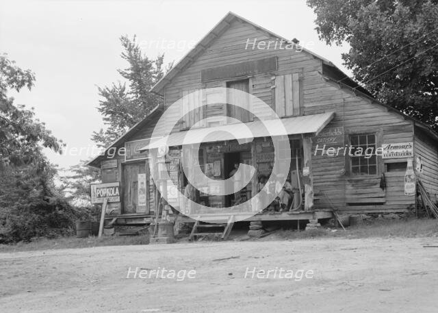 Country store on dirt road, Sunday afternoon, near Gordenton, North Carolina, 1939. Creator: Dorothea Lange.