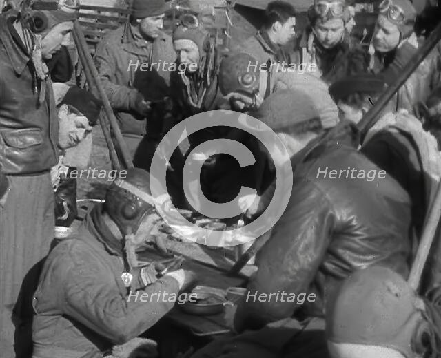 American Airmen Sitting and Eating in an Airfield, 1943-1944. Creator: British Pathe Ltd.