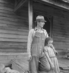Tobacco sharecropper with his oldest daughter, Person County, North Carolina, 1939. Creator: Dorothea Lange.
