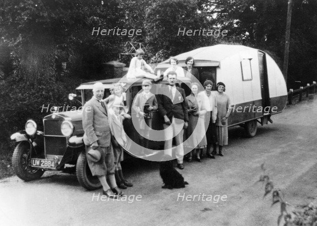 Family group with their 1930 Fiat towing a caravan, (c1930?). Artist: Unknown