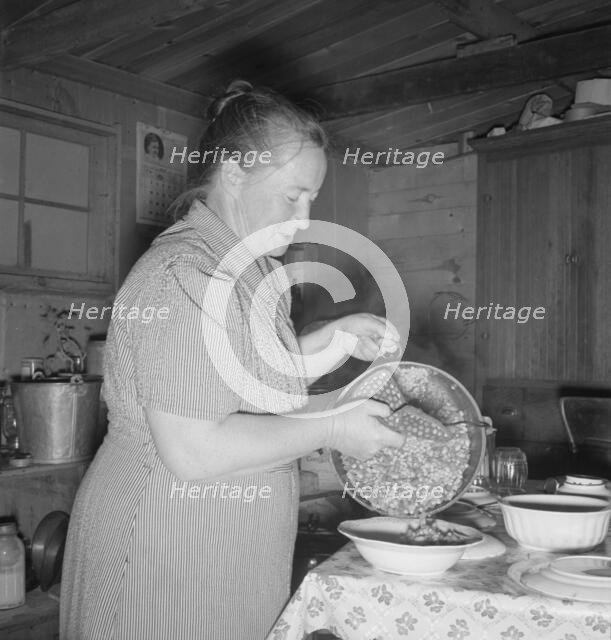 Mrs. Wardlow getting dinner after church in her basement..., Dead Ox Flat, Oregon, 1939. Creator: Dorothea Lange.