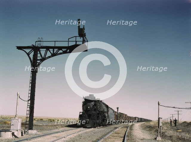West bound Santa Fe R.R. freight train waiting in a siding..., Ricardo, New Mexico, 1943. Creator: Jack Delano.