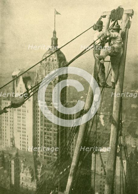 'Crane Men at Work on a New York Skyscraper', c1930. Creator: GPA.