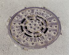 Drain cover plate made by Bunce of Shrivenham, Swindon, Wiltshire, 2006.  Artist: Peter Williams.