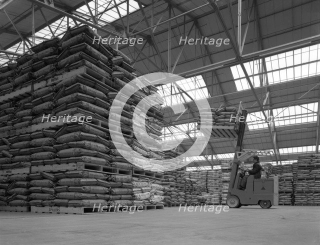 Warehouse scene with forklift truck, Spillers Foods, Gainsborough, Lincolnshire, 1961. Artist: Michael Walters