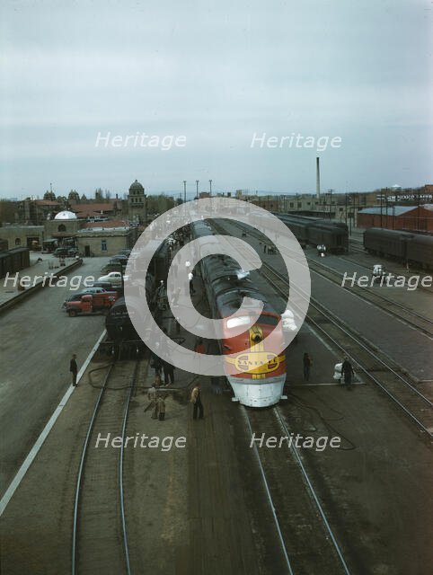 Santa Fe R.R. streamliner, the "super Chief," being serviced..., Albuquerque, N.Mexico , 1943. Creator: Jack Delano.