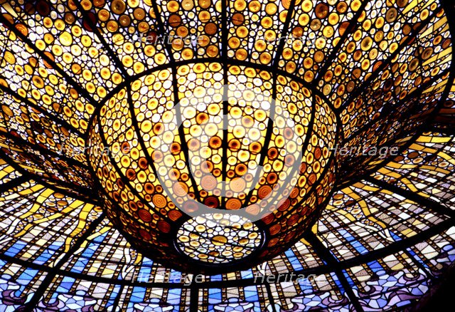 Detail of the Modernist stained glass window in the roof of the Palau de la Música Catalana in Ba…