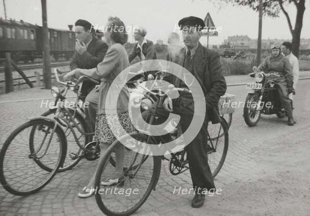 Cyclists by a level crossing, Landskrona, Sweden, 1950. Artist: Unknown