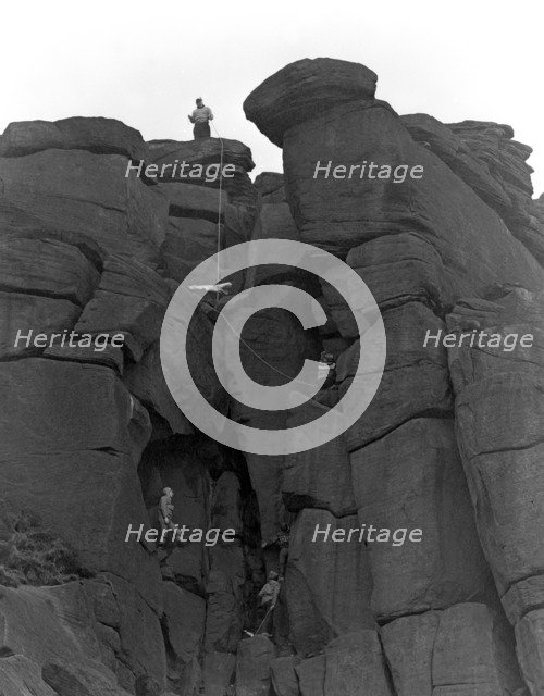 Climbers on Stanage Edge, Hathersage, Derbyshire, 1964.  Artist: Michael Walters
