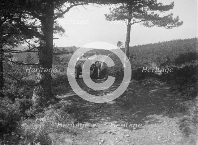Kitty Brunell road testing a Riley 9 WD tourer, c1930. Artist: Bill Brunell.