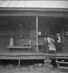 Porch of Negro tenant house, showing household equipment, Person County, North Carolina, 1939. Creator: Dorothea Lange.