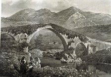 Bridge in Cangas de Onis on the River Sella and the hermitage of Santa Cruz, lithograph of the wo…