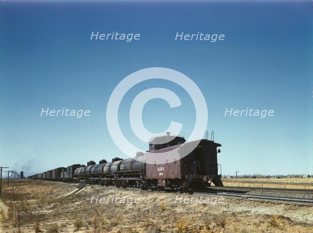 Santa Fe R.R. west bound freight stopping for water, Melrose, New Mexico, 1943. Creator: Jack Delano.