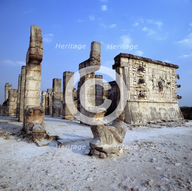 Chichen Itza, view of Temple of the Warriors, with a sculpture in foreground.