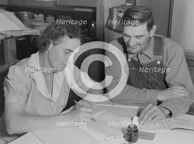 FSA borrowers on new farm keep account of their loan, Dead Ox Flat, Malheur County, Oregon, 1939. Creator: Dorothea Lange.