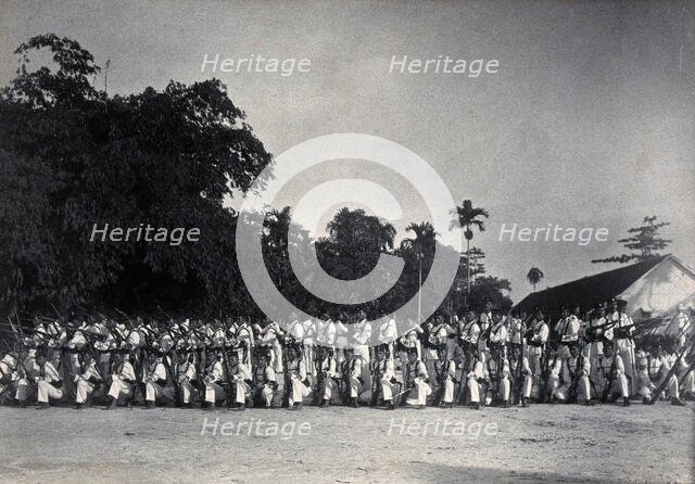Sarawak: a line-up of armed Sarawak Rangers, c1900. Creator: Unknown.