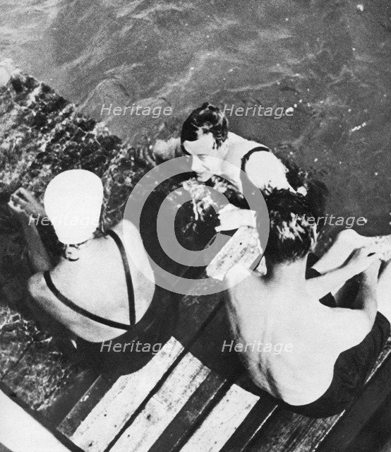 The Prince of Wales with friends on a raft, the Riviera, c1930s. Artist: Unknown