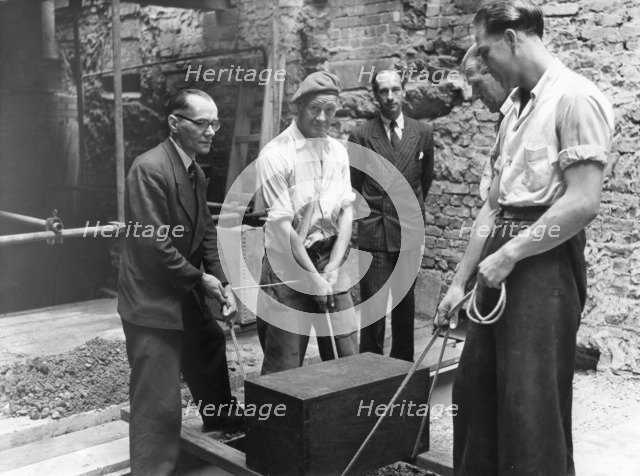 Burying a box containing copies of the Jewish Chronicle, London, 1955. Artist: Unknown