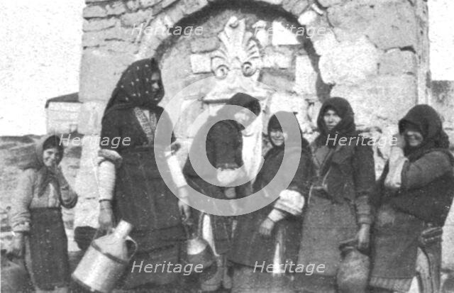 ''Impressions Macedoniennes; Femmes tziganes a la fontaine dans un village grec.', 1915. Creator: Unknown.