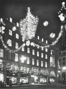 Christmas illuminations on Regent Street, West End, looking to Austin Reed at 103-113, London, 1970. Creator: Unknown.