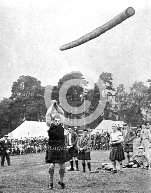 Tossing the caber at the Highland games, Scotland, 1936. Artist: Fox
