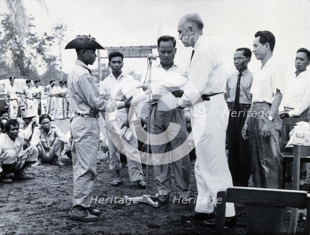 Fritz Ronnefeldt distributing medicine, c1940s. Creator: Unknown.