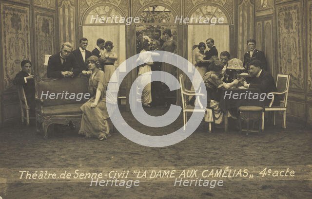 French or Belgian prisoners of war, some in drag, posing on stage during a crowded scene..., (1918?) Creator: Unknown.