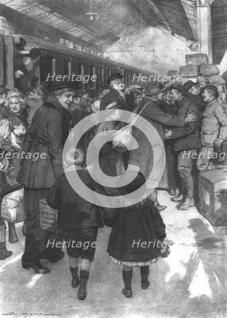 'Rapatries; l'arrivee d'un train a Evian: des territoriaux de service sur le quai sont..., 1917. Creator: J Simont.