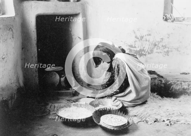 Zuni bread maker, c1903. Creator: Edward Sheriff Curtis.