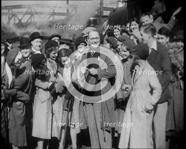 People Standing at  a Train Station, 1933. Creator: British Pathe Ltd.