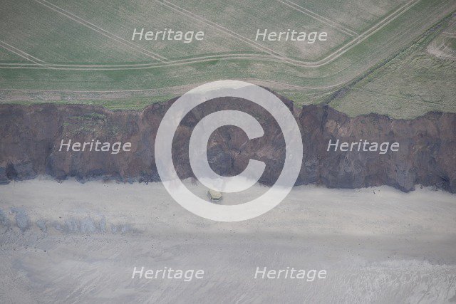 Collapsed pillbox on the beach, near Beacon Hill, East Riding of Yorkshire, 2014. Creator: Historic England Staff Photographer.