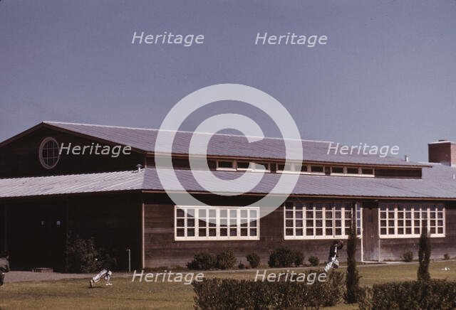 Boys flying a kite in front of the community center, FSA camp, Robstown, Tex., 1942. Creator: Arthur Rothstein.