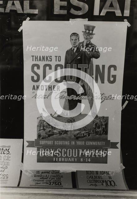 Poster in real estate window, Harlingen, Texas,  1939-02. Creator: Russell Lee.