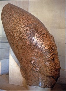 Head of Amenhotep III, on pink granite, it comes from his temple at Thebes.