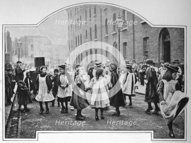 Dancing to a street organ, London, c1901 (1901). Artist: Unknown.