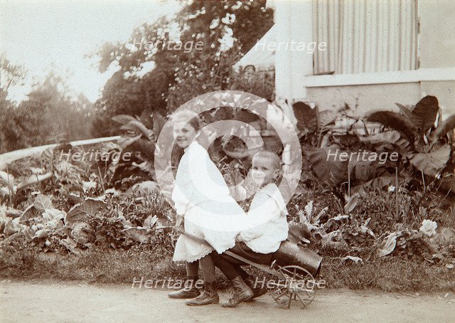 Two children playing outdoors, 1890s. Artist: Unknown