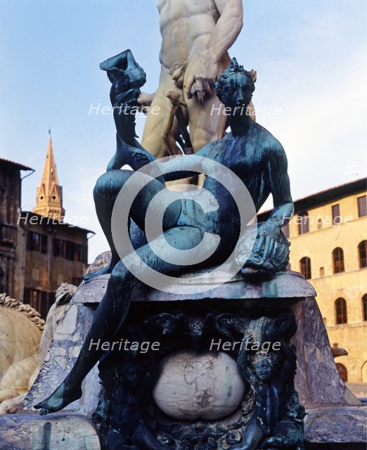 Fountain of Neptune in the Piazza della Signoria in Florence, detail of bronze figures surroundin…