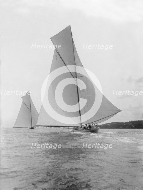 The majestic cutters 'White Heather' and 'Shamrock' race downwind, 1912. Creator: Kirk & Sons of Cowes.