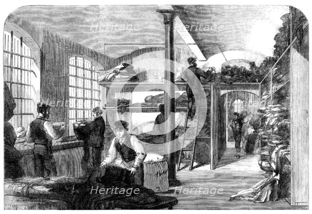 The Cotton Famine: receiving clothes at Bridewell Hospital...for the distressed operatives, 1862. Creator: Unknown.