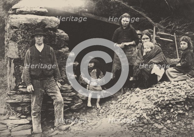 The Great Famine. A family at the ruins of their house in Killarney, 1888.