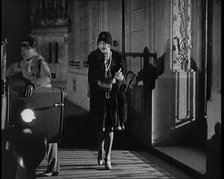 Scene from the Film 'The Compulsory Husband':  The Actor Monty Banks Opening the Car..., 1920s. Creator: British Pathe Ltd.