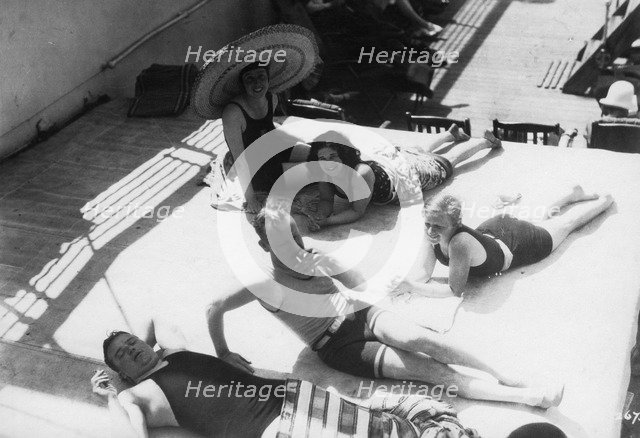 Passengers sunbathing on board a cruise ship, c1920s-c1930s(?). Artist: Unknown