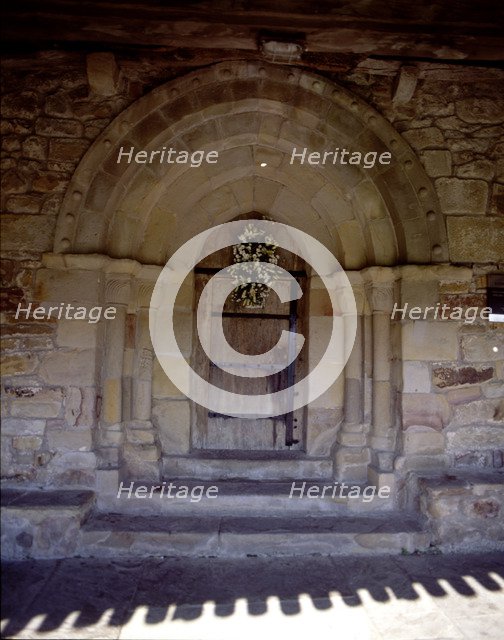 View of the door of the hermitage of San Pelayo, both the door and windows are pointed, the bell …