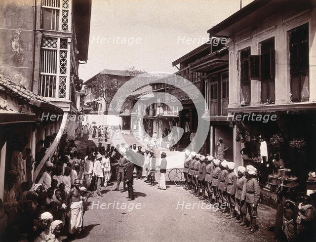 A group of officials making a visit to a house in Bombay, suspected of holding people with..., 1896. Creator: Unknown.