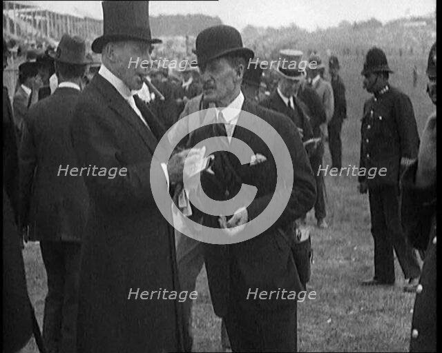 Hugh Cecil Lowther, 5th Earl of Lonsdale, Wearing a Top Hat Smoking a Cigar at a Horse racing Event, Creator: British Pathe Ltd.