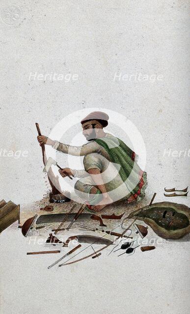 Delhi: a carpenter chipping at wood, (between 1800 and 1899?). Creator: Unknown.